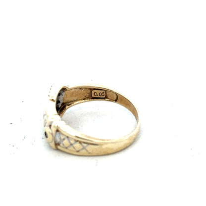 9ct yellow gold diamond buckle ring in size R with sparkling diamonds, showcasing an elegant jewelry design.