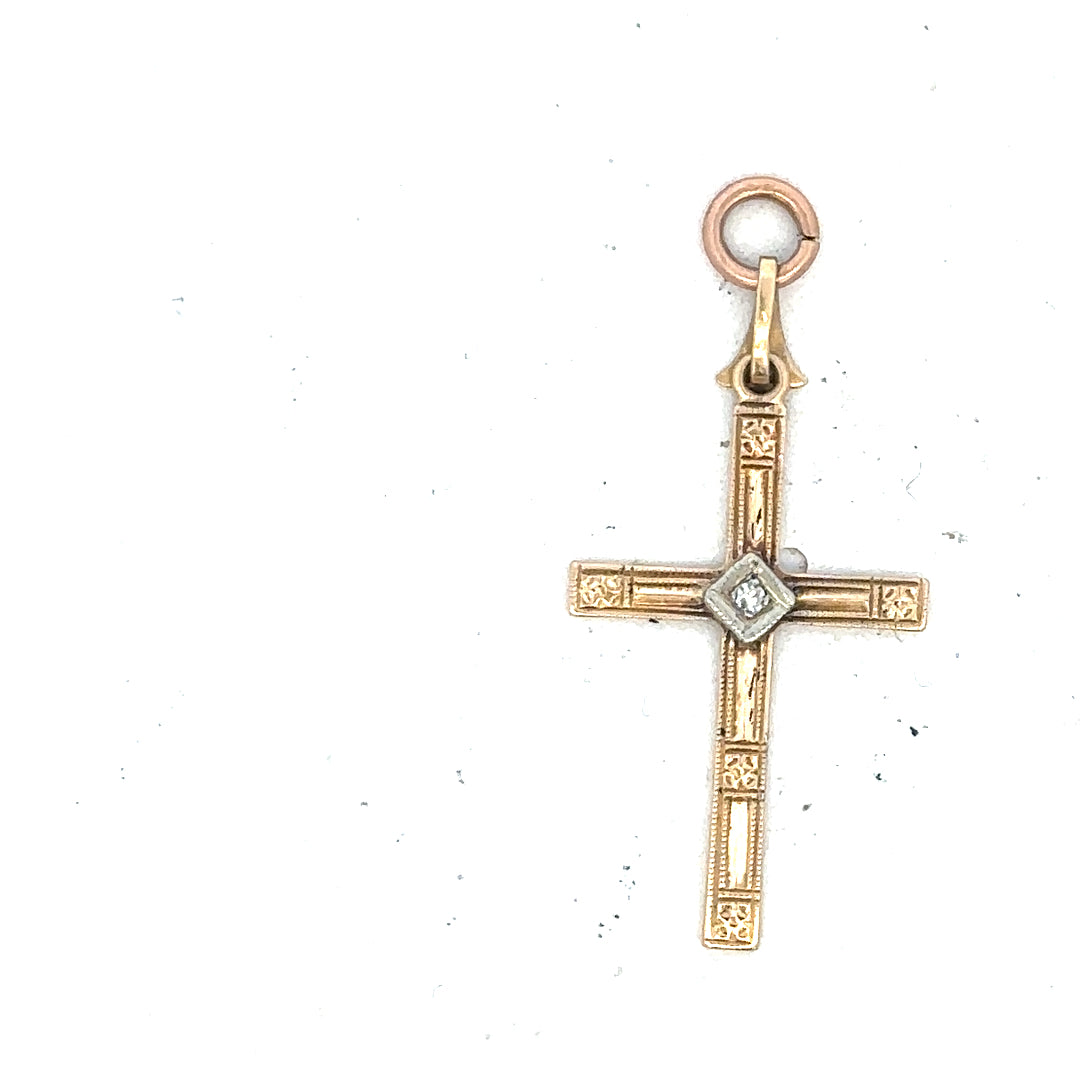 9ct yellow gold diamond cross pendant with sparkling diamonds, weighs 0.9g, elegant jewelry piece with detailed craftsmanship.