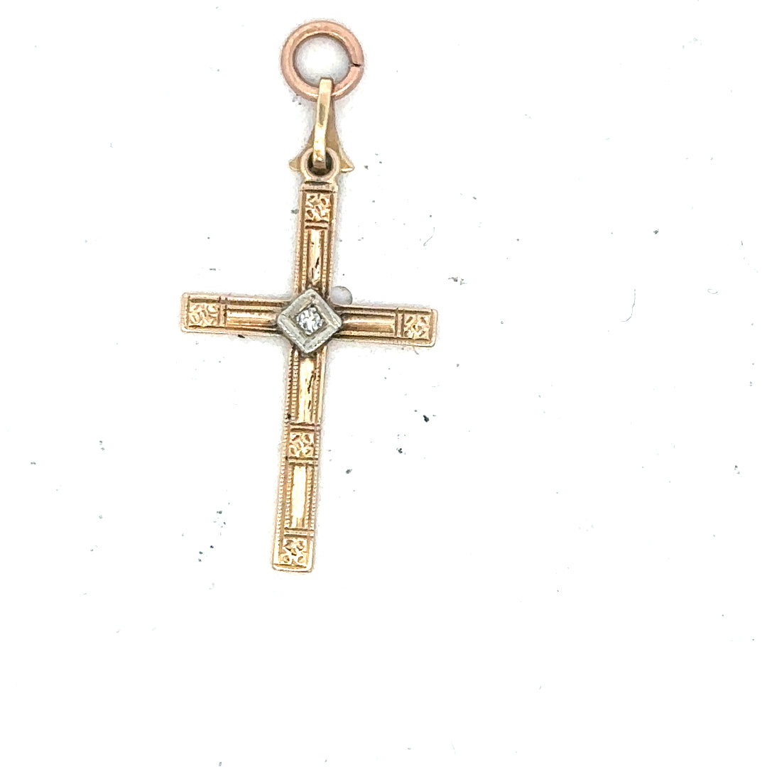 9ct yellow gold diamond cross pendant with sparkling diamonds, weighs 0.9g, showcasing elegant jewelry craftsmanship.