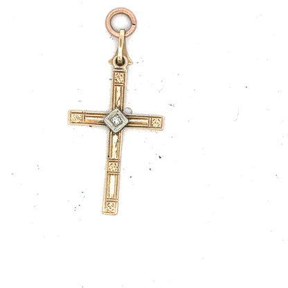 9ct yellow gold diamond cross pendant with sparkling diamonds, weighs 0.9g, showcasing elegant jewelry craftsmanship.