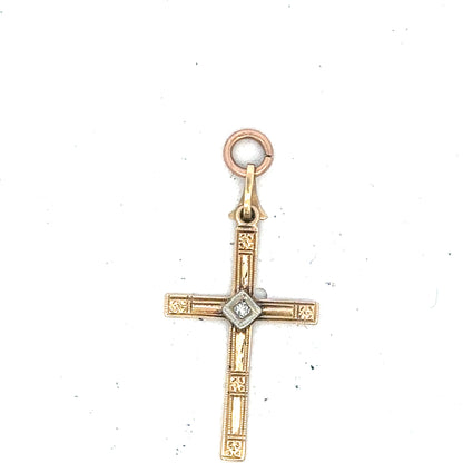 9ct yellow gold diamond cross pendant with sparkling diamonds, weighs 0.9g, featuring an elegant religious jewelry design.