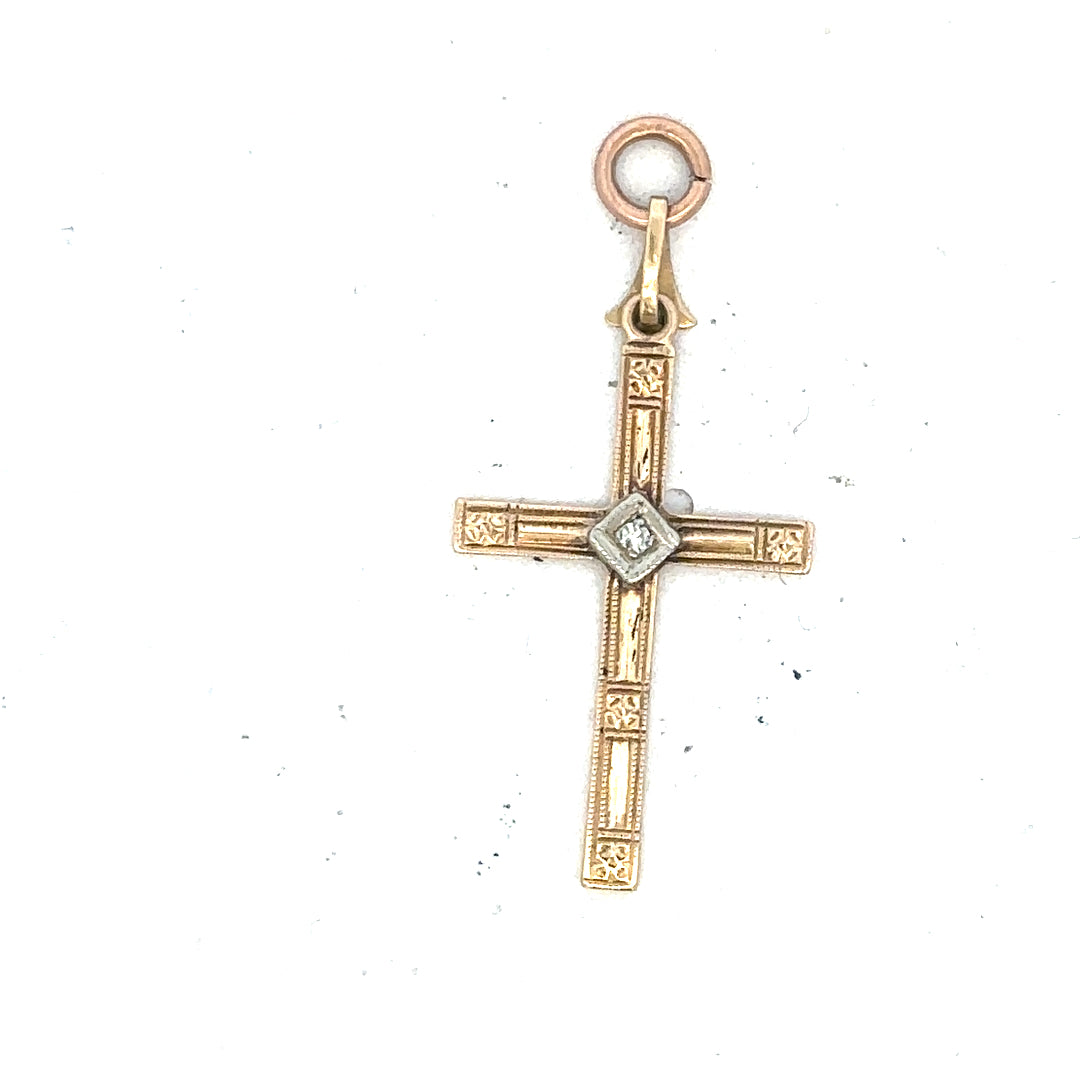 9ct yellow gold diamond cross pendant with sparkling diamonds, weighing 0.9g, displayed against a neutral background.