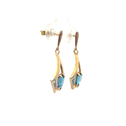 9ct yellow gold diamond earrings with sparkling stones, weighing 1.6g, featuring elegant and classic jewelry design.