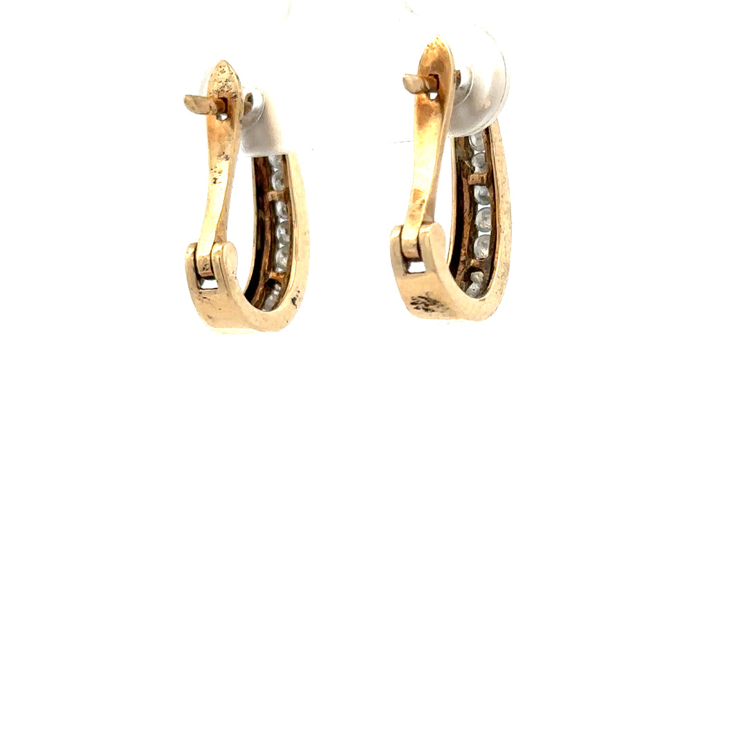 9ct yellow gold diamond earrings with sparkling stones, weighing 3.1g, unbranded jewelry suitable for elegant occasions.