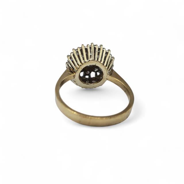 9ct yellow gold diamond ring with sparkling diamonds, showcasing elegant design and craftsmanship.