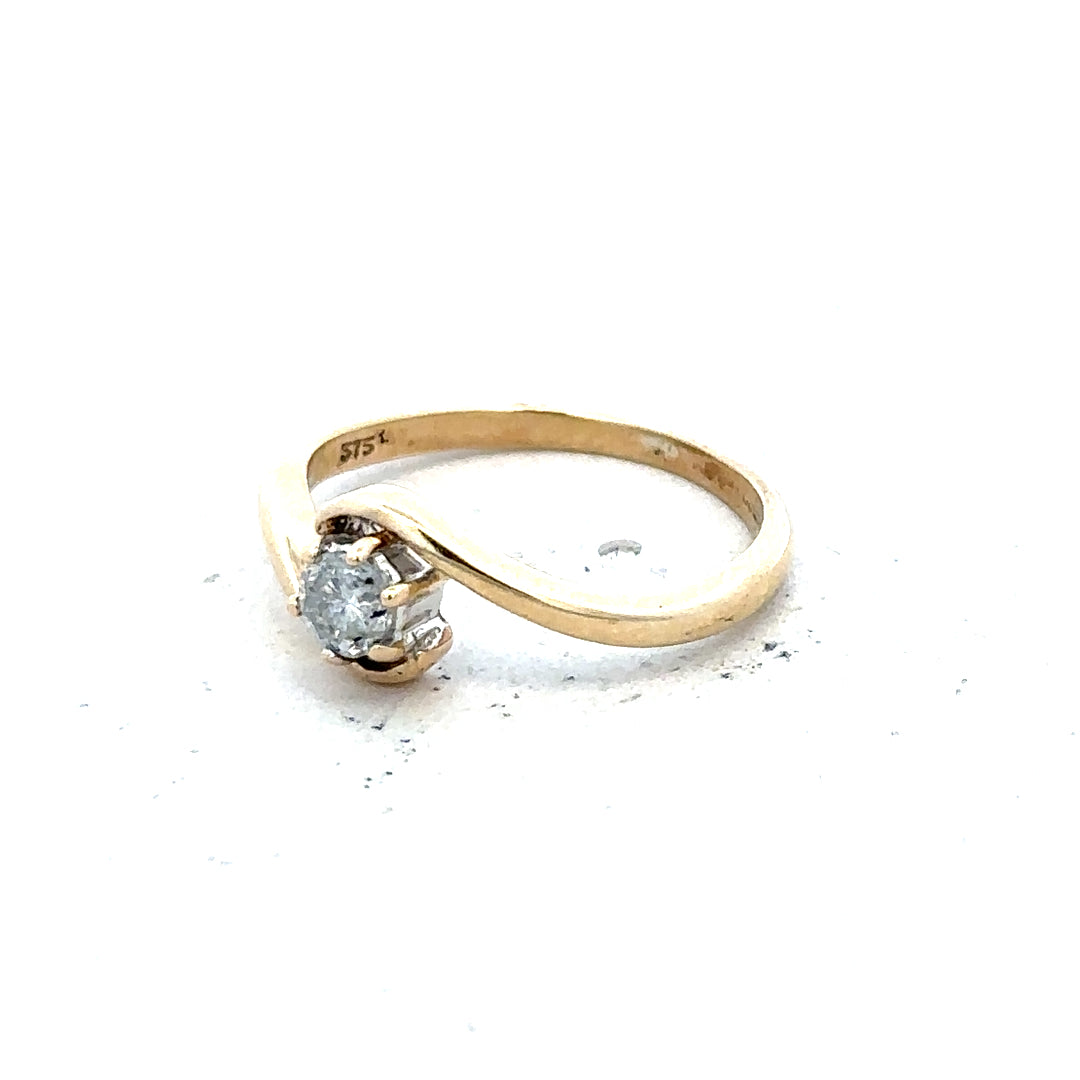 9ct yellow gold diamond ring, size I 1/2, showcasing a sparkling diamond setting and a sleek gold band.