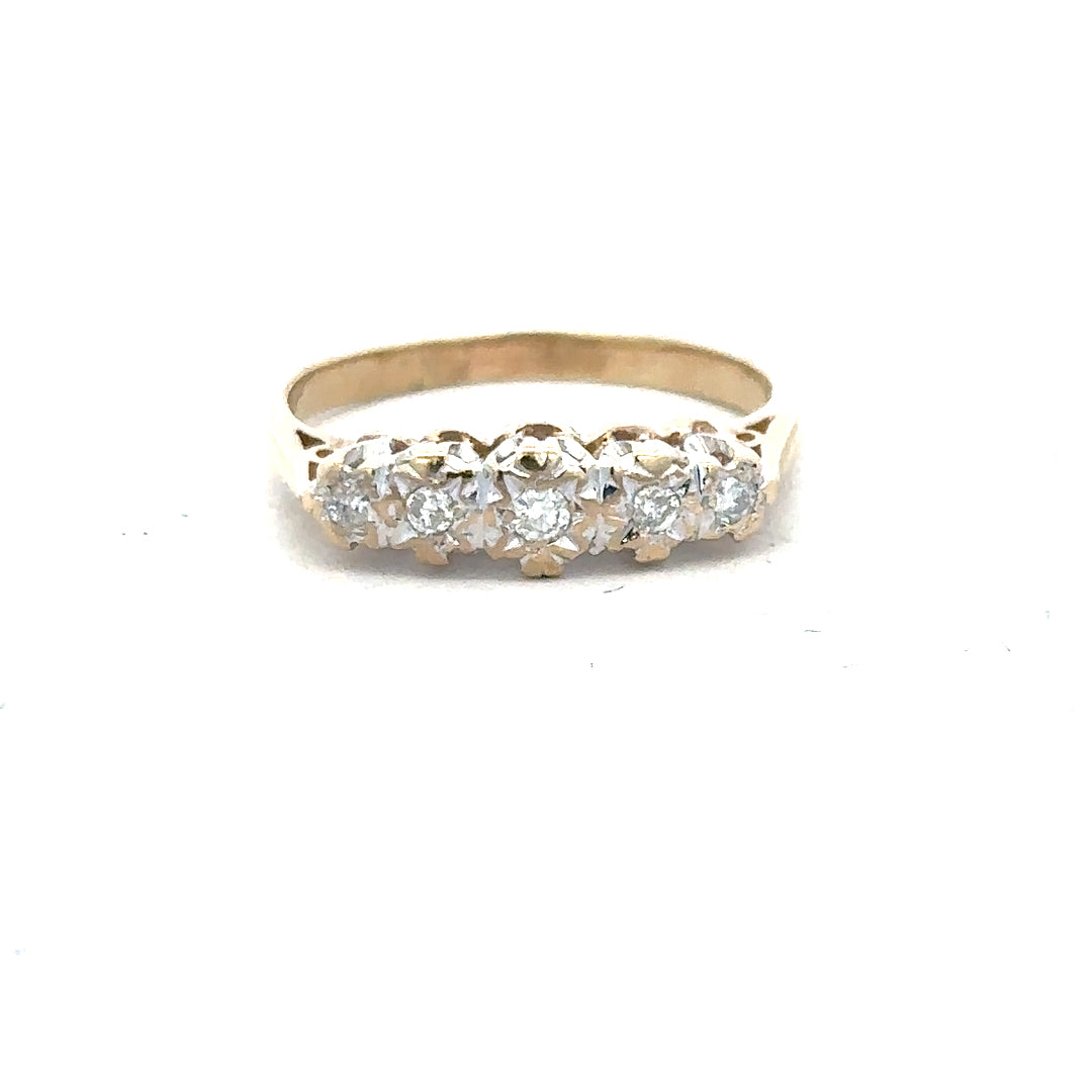 9ct yellow gold diamond ring in size J with sparkling diamonds, showcased against a neutral background.