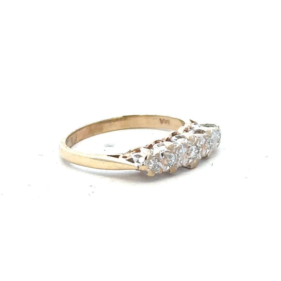 9ct yellow gold diamond ring in size J with a sparkling diamond, showcasing elegant jewelry design.