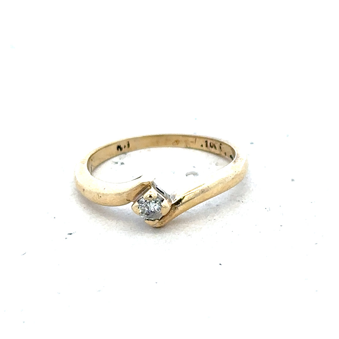 9ct yellow gold diamond ring in size K 1/2 with 2.3g, featuring a sparkling diamond setting.