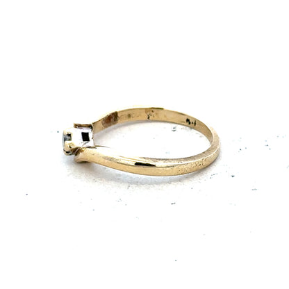 9ct yellow gold diamond ring in size K 1/2, featuring a sparkling diamond, weighs 2.3 grams, unbranded jewelry.