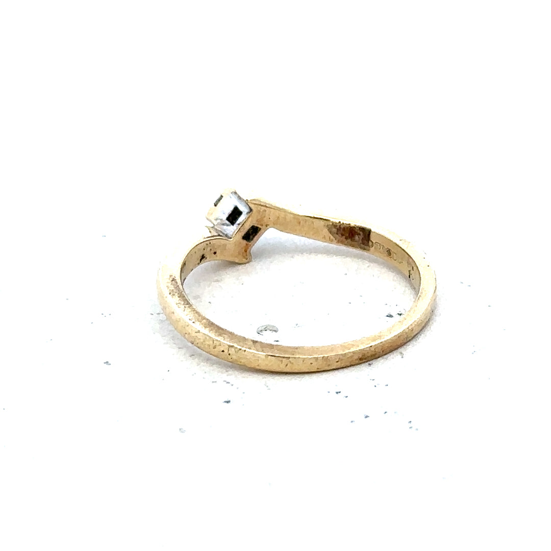 9ct yellow gold diamond ring, size K 1/2, weighing 2.3 grams, featuring a sparkling diamond design.