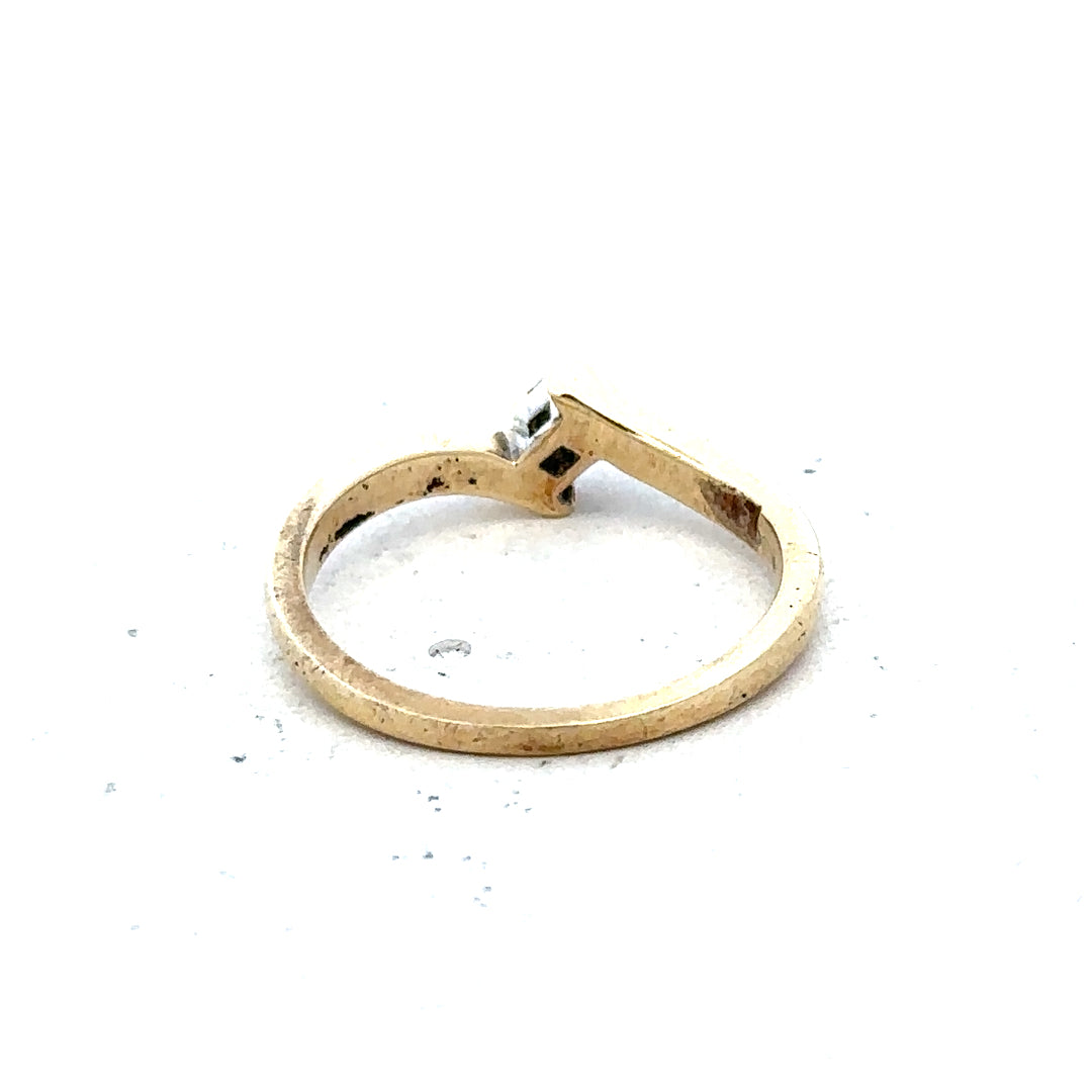 9ct yellow gold diamond ring in size K 1/2, featuring a sparkling diamond and weighing 2.3 grams.