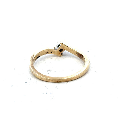 9ct yellow gold diamond ring in size K 1/2, featuring a sparkling diamond and weighing 2.3 grams.