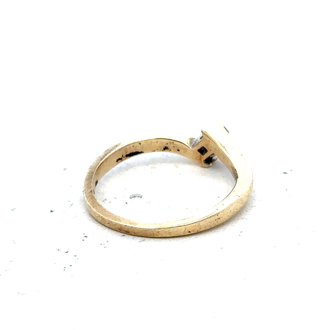 9ct yellow gold diamond ring, size K 1/2, weighing 2.3g, featuring a sparkling diamond setting on a classic band.