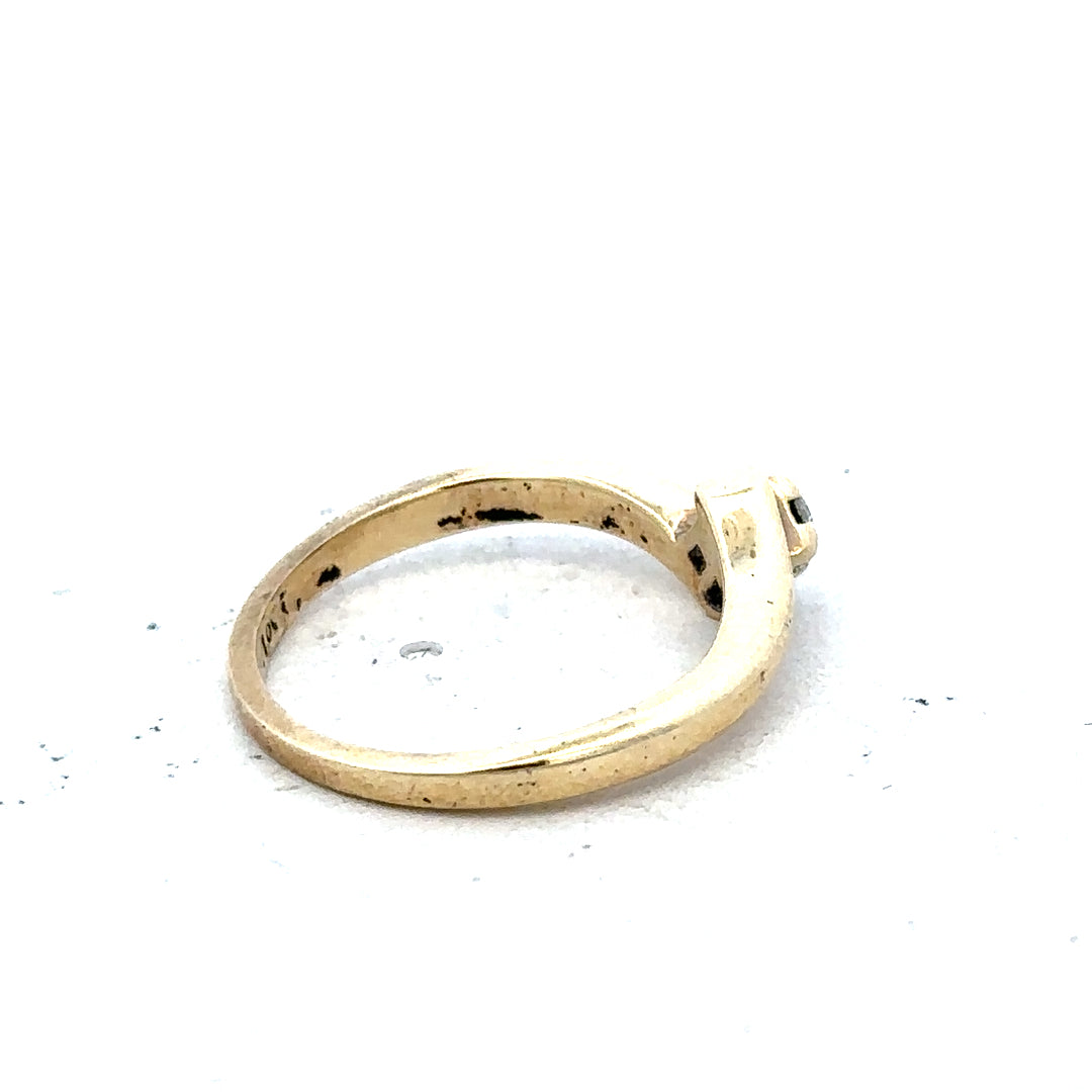 9ct yellow gold diamond ring in size K 1/2, featuring a sparkling diamond setting, weighs 2.3 grams.