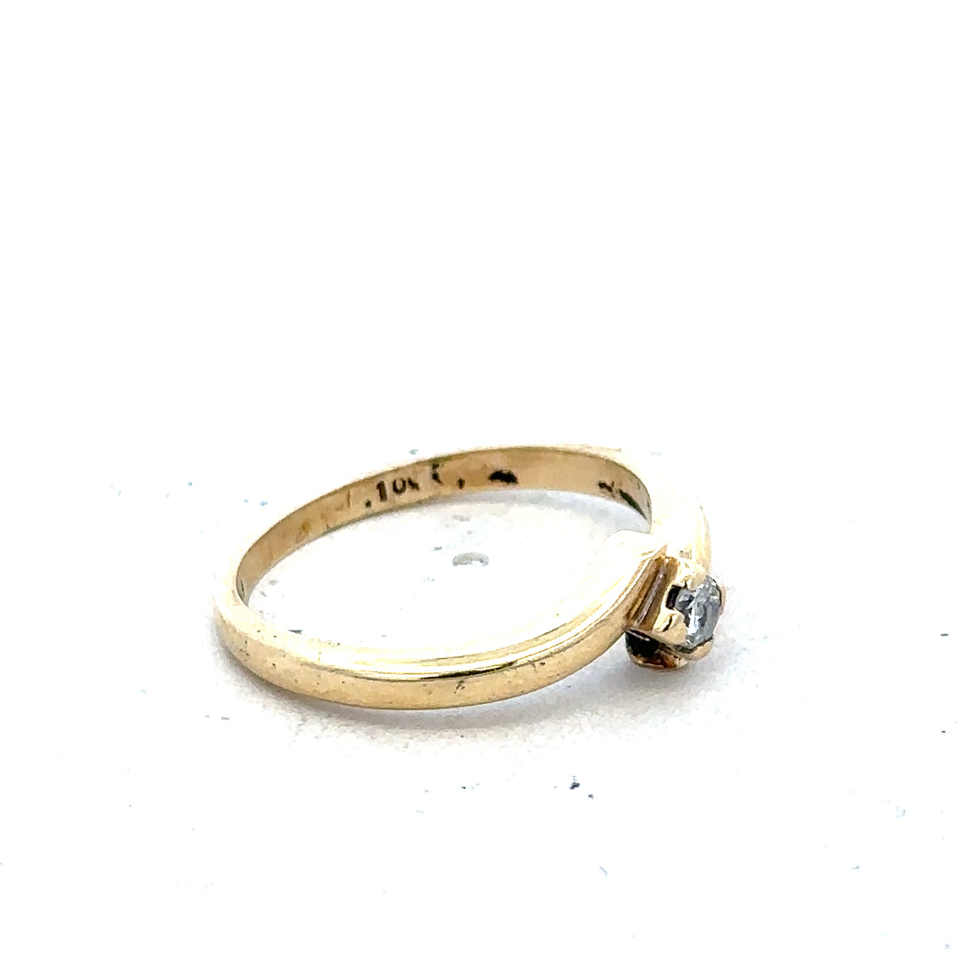 9ct yellow gold diamond ring in size K 1/2 with 2.3g weight, featuring sparkling diamonds and a classic design.