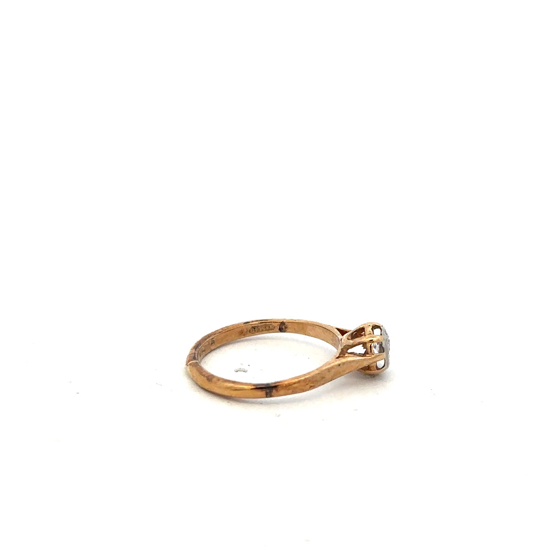 9ct yellow gold diamond ring in size K with sparkling diamonds, showcased on a neutral background.