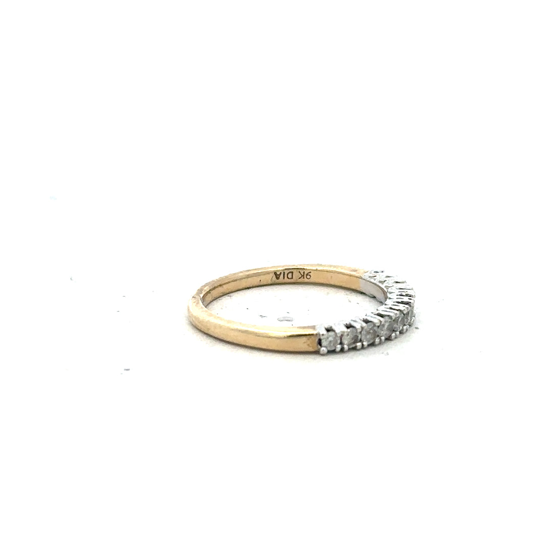9ct yellow gold diamond ring in size K, featuring a sparkling diamond centerpiece on a sleek band.
