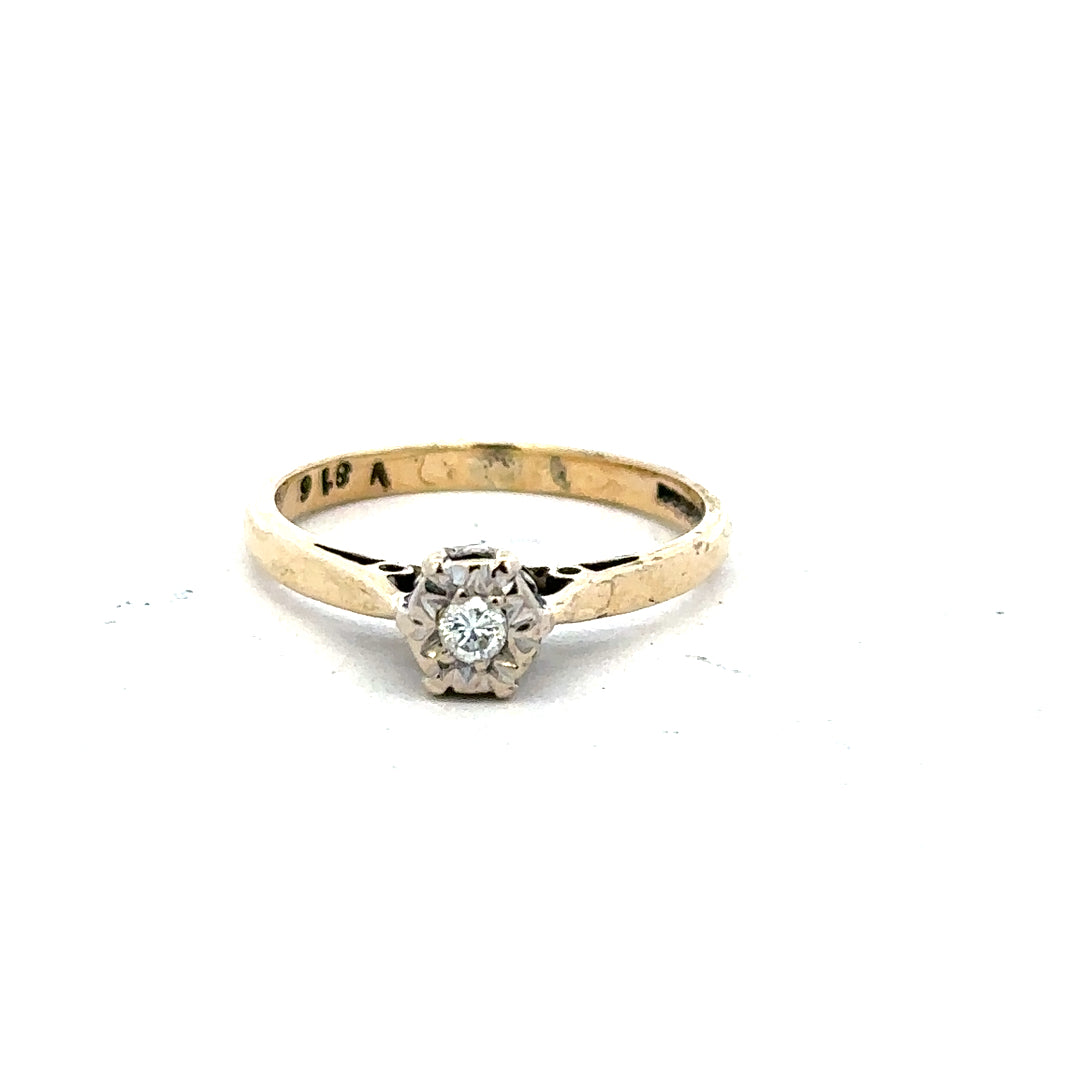 9ct yellow gold diamond ring in size K with sparkling diamonds, showcased on a plain background.