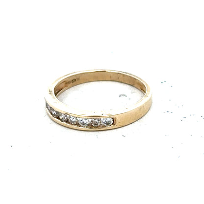 9ct yellow gold diamond ring size K1/2 with sparkling stones, showcasing its elegant design and polished finish.