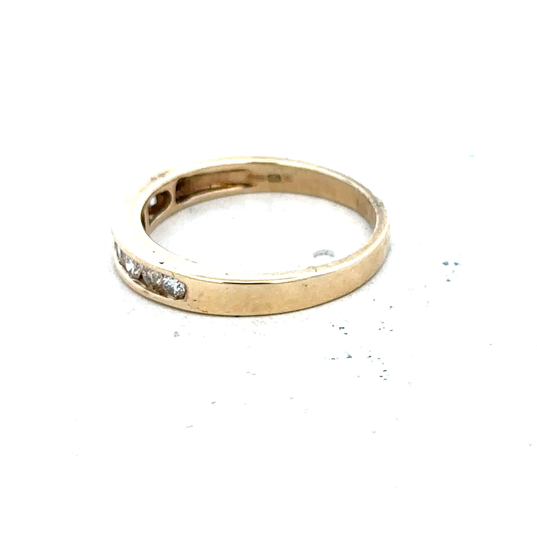 9ct yellow gold diamond ring size K1/2 with a sparkling diamond, showcasing elegant jewelry design.