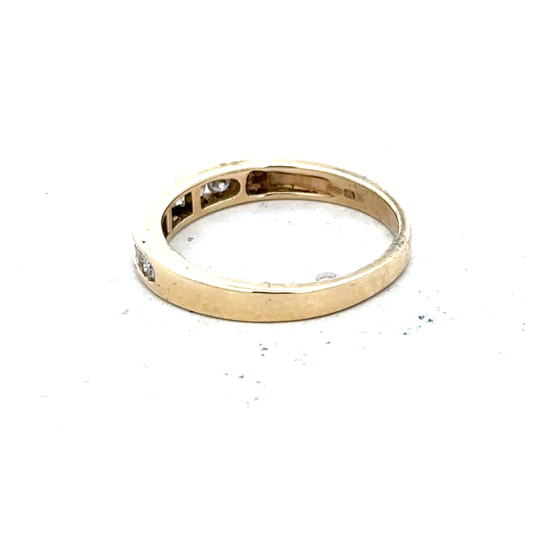9ct yellow gold diamond ring in size K1/2 with sparkling diamonds on a plain white background.
