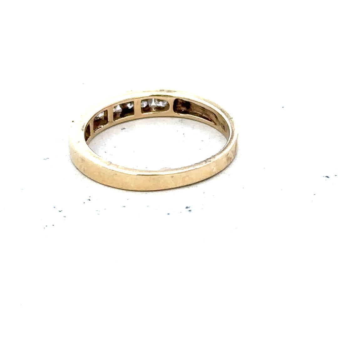 9ct yellow gold diamond ring in size K1/2, featuring a sparkling diamond set in a simple, elegant band.