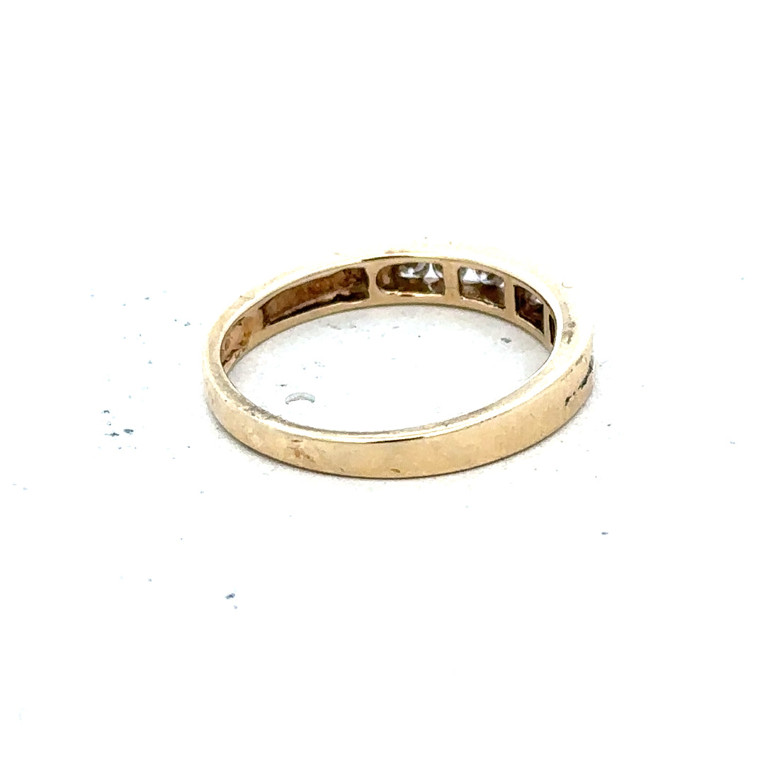 9ct yellow gold diamond ring in size K1/2, featuring a sparkling diamond set in an elegant band.