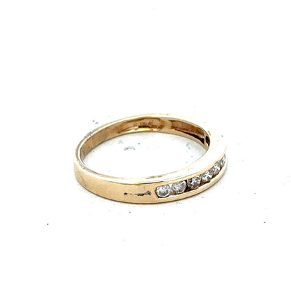 9ct yellow gold diamond ring size K1/2 with a sparkling diamond, showcasing elegant jewelry design.