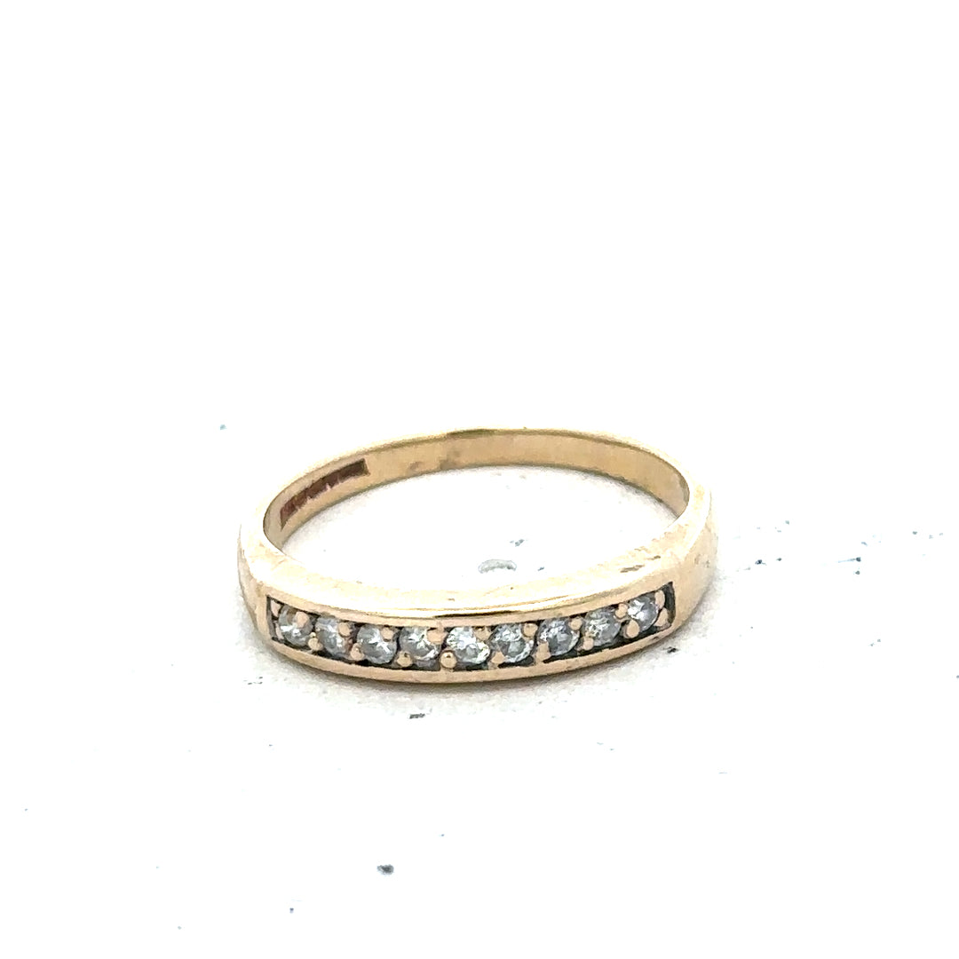 9ct yellow gold diamond ring in size K1/2 with sparkling diamonds, featuring a simple elegant design.