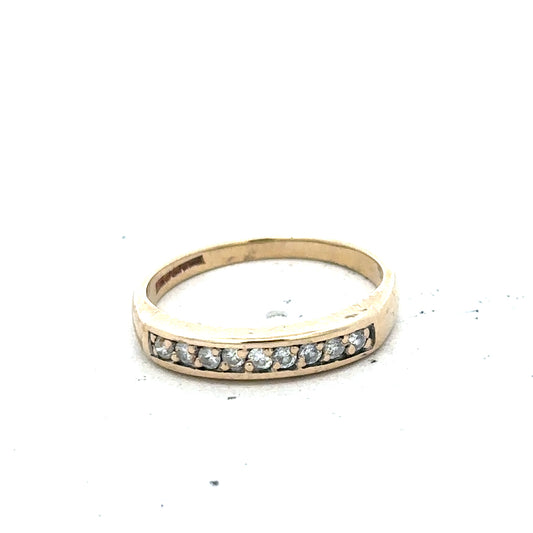 9ct yellow gold diamond ring in size K1/2 with sparkling diamonds, featuring a simple elegant design.