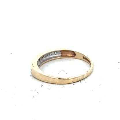 9ct yellow gold diamond ring size K1/2 with sparkling diamonds, showcasing elegant jewelry design and craftsmanship.