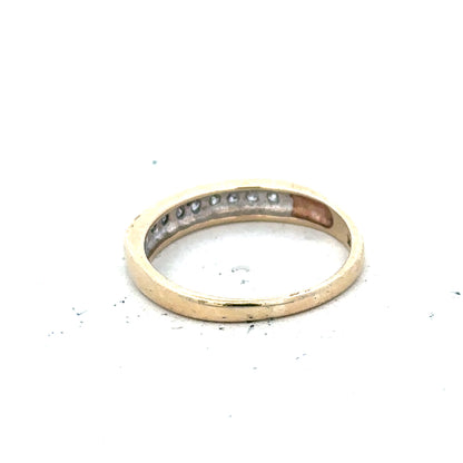 9ct yellow gold diamond ring size K1/2 with sparkling diamonds, showcasing an elegant jewelry design.