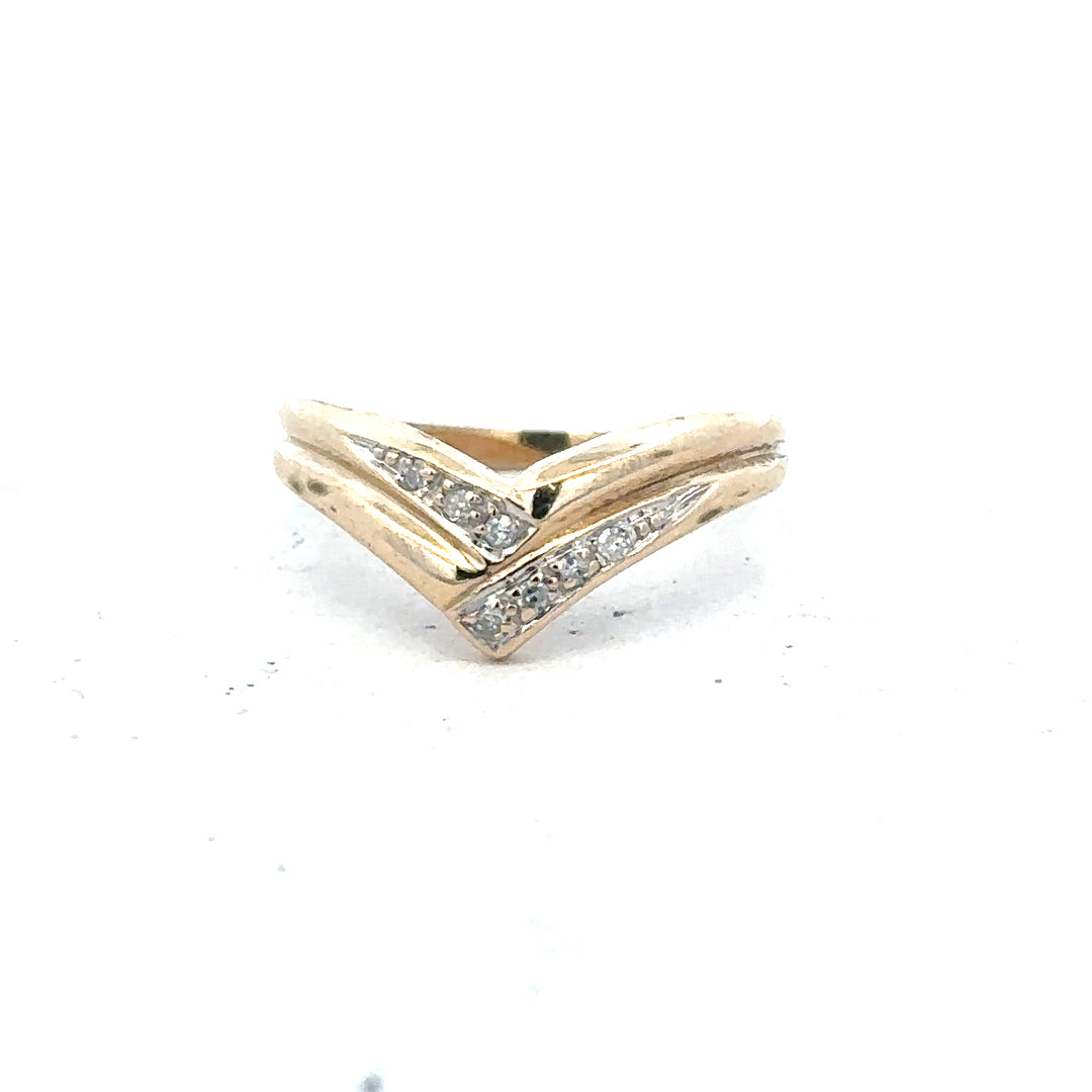 9ct yellow gold diamond ring in size L, featuring a sparkling diamond, unbranded jewelry displayed against a neutral background.