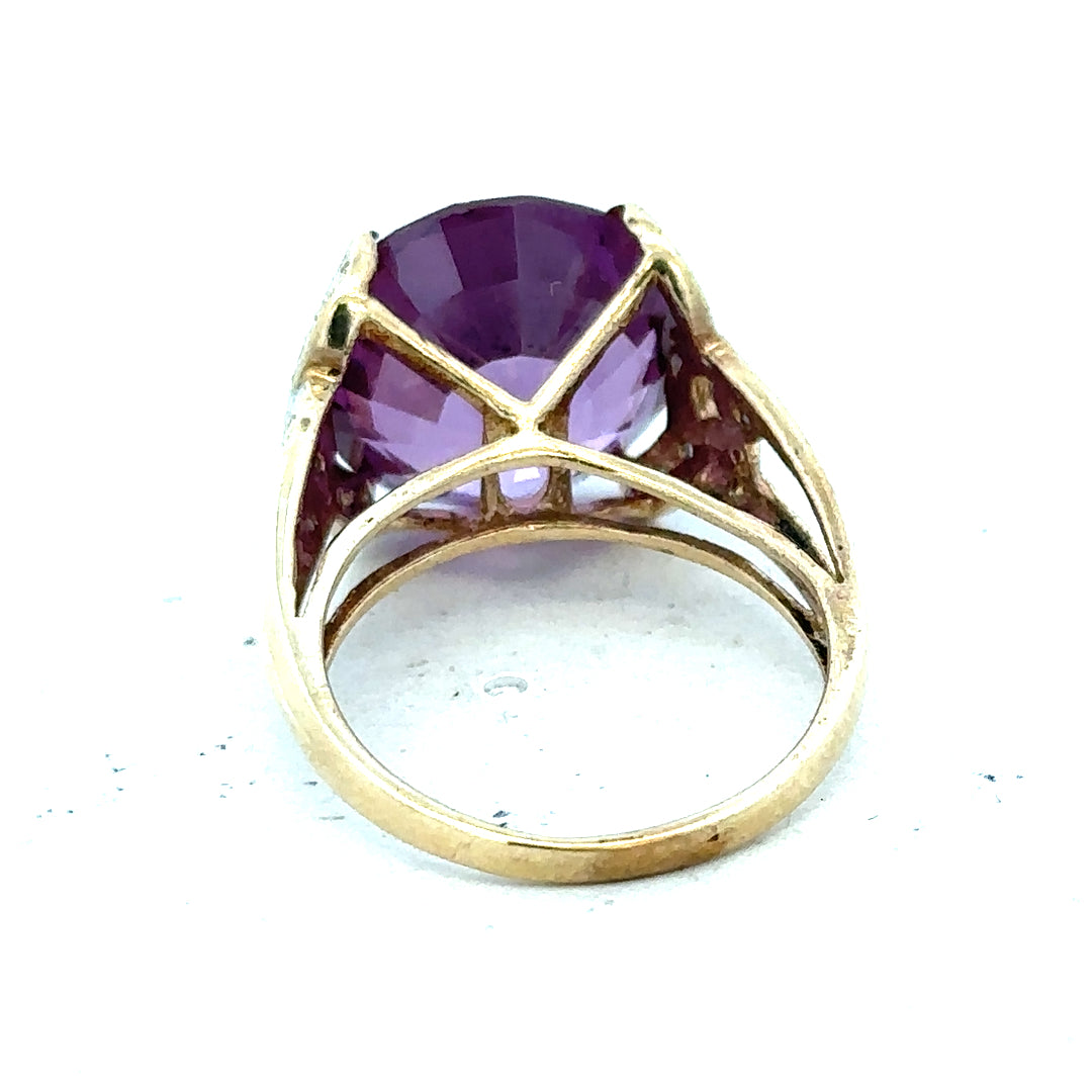 9ct yellow gold diamond ring in size M with a polished finish, showcasing a sparkling central diamond design.