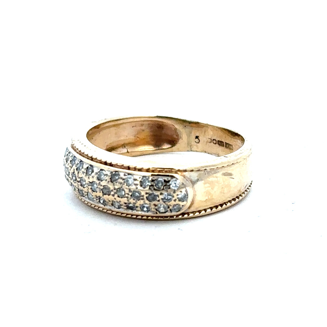 9ct yellow gold diamond ring in size M with sparkling diamonds, photographed on a neutral background.