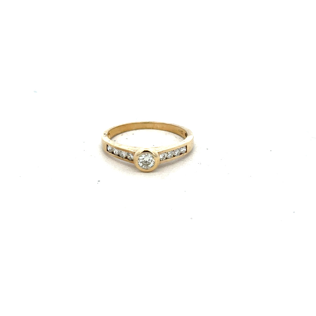 9ct yellow gold diamond ring in size N with sparkling diamonds, showcasing elegant jewelry design.