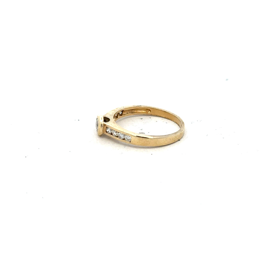 9ct yellow gold diamond ring in size N with sparkling diamonds, showcasing elegant jewelry craftsmanship.