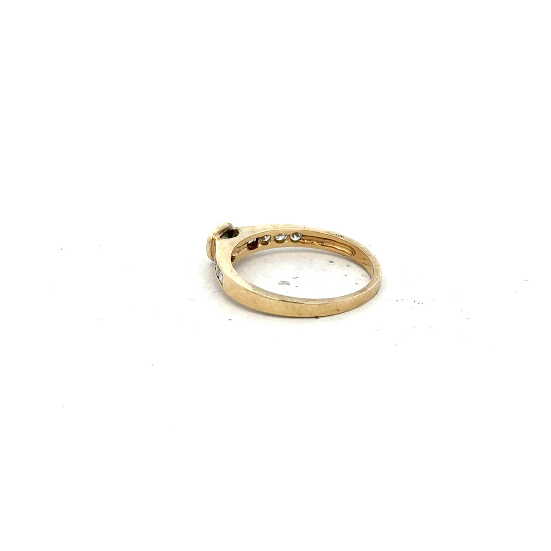 9ct yellow gold diamond ring in size N with sparkling diamonds, showcased on a neutral background.