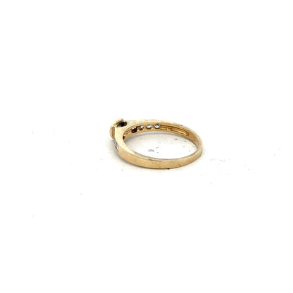 9ct yellow gold diamond ring in size N with sparkling diamonds, showcased on a neutral background.