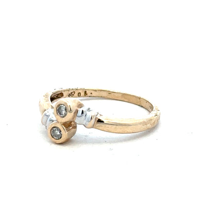 9ct yellow gold diamond ring in size O with a sparkling central diamond, showcased on a plain background.