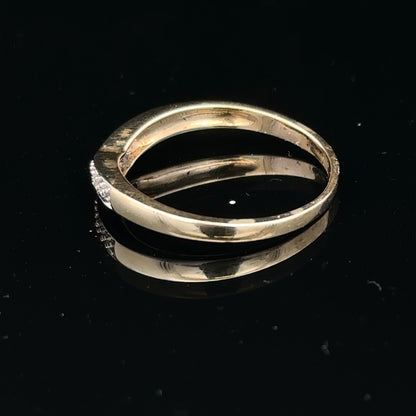 9ct yellow gold diamond ring in size P, showcasing a polished band with a sparkling diamond centerpiece.