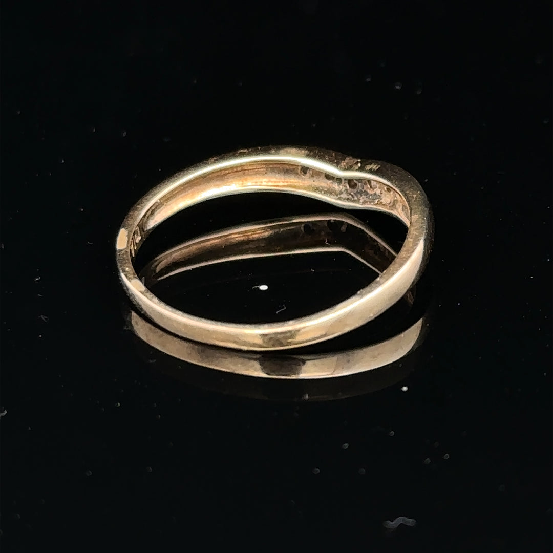 9ct yellow gold diamond ring in size P with a sparkling central diamond and elegant band, unbranded jewelry design.