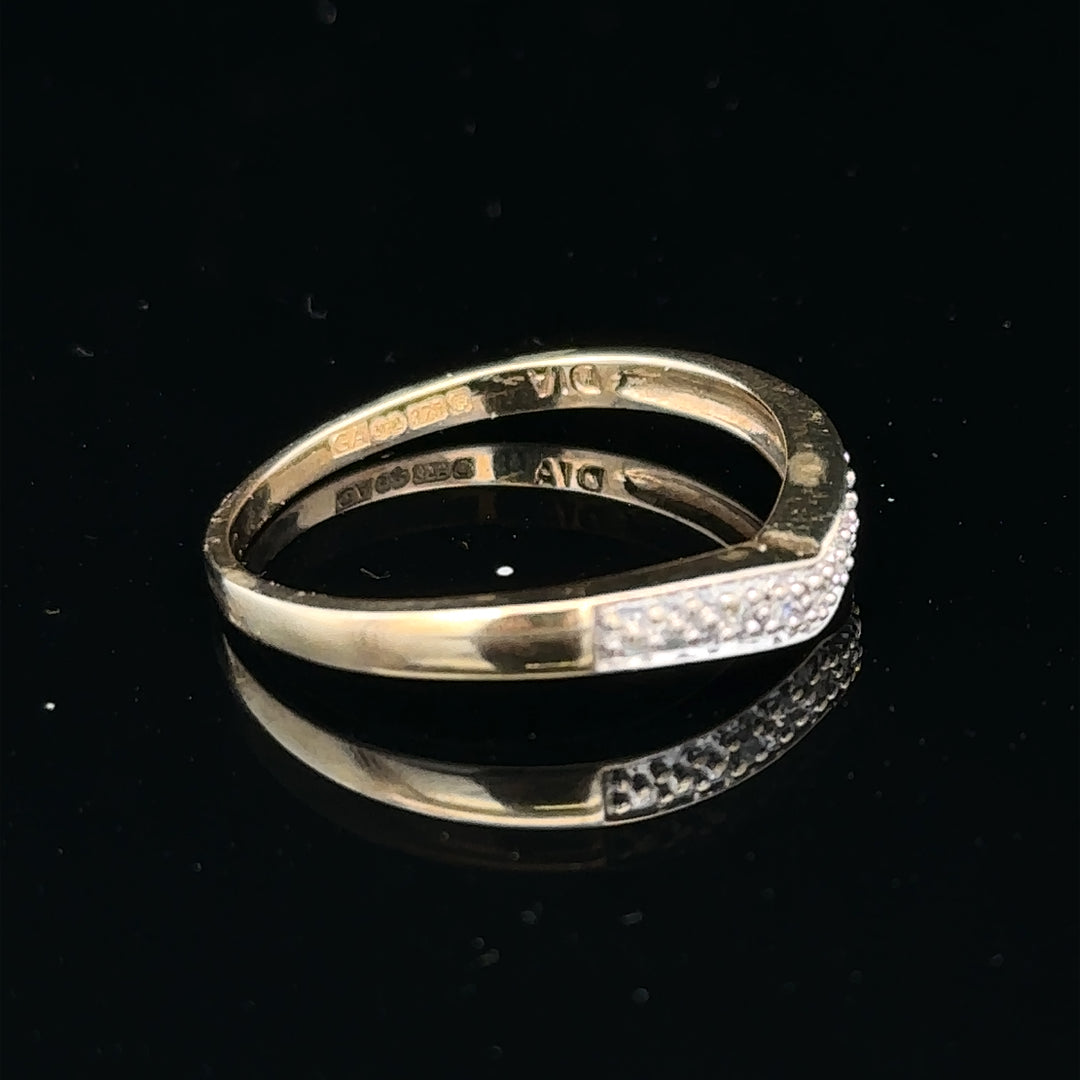 9ct yellow gold diamond ring in size P, featuring a sparkling central diamond and elegant band design.