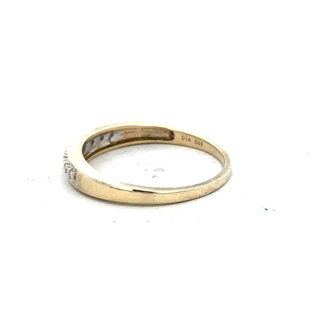9ct yellow gold diamond ring in size P with sparkling diamonds, showcasing a elegant jewelry design.