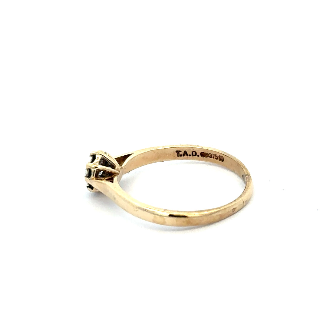 9ct yellow gold diamond ring in size R with sparkling diamonds, showcasing an elegant jewelry design.