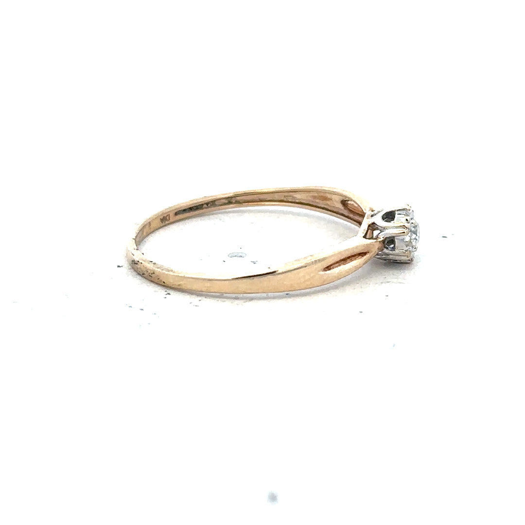 9ct yellow gold diamond ring in size S with a sparkling diamond, unbranded, showcasing elegant jewelry design.