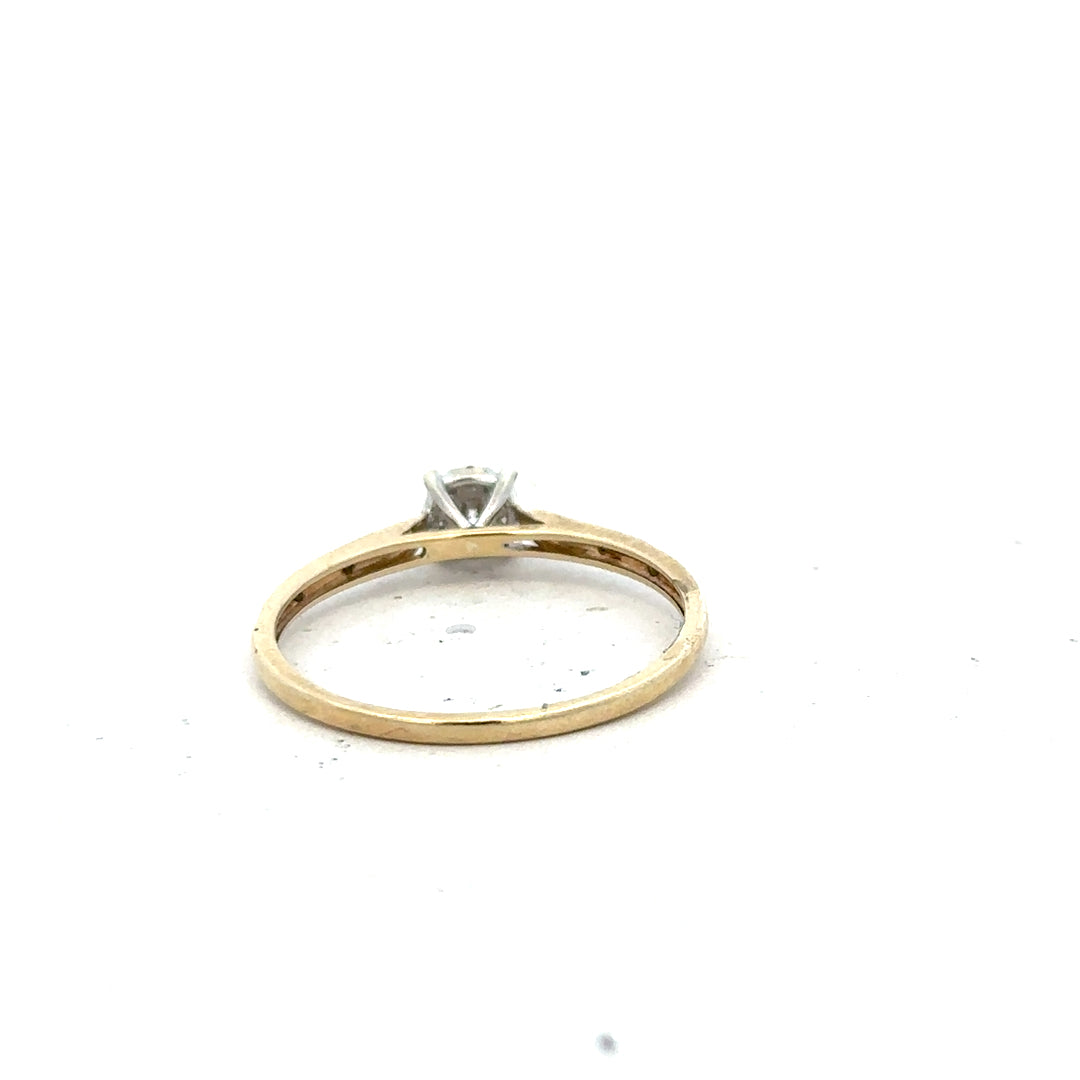 9ct yellow gold diamond ring in size T, featuring a sparkling diamond set in an elegant unbranded design.