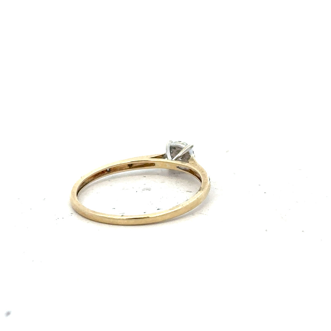 9ct yellow gold diamond ring in size T with sparkling diamonds, unbranded jewelry piece displayed on a plain background.