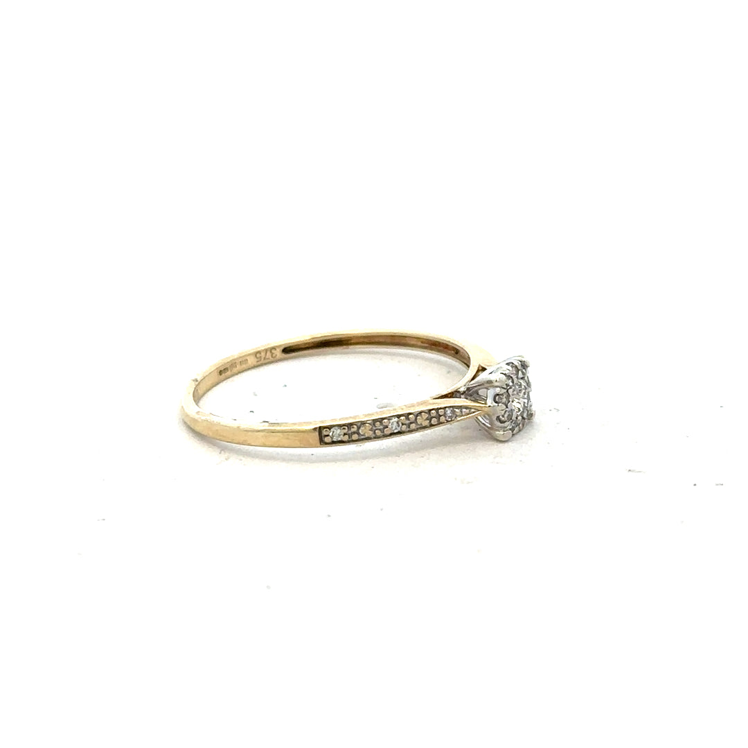 9ct yellow gold diamond ring in size T with sparkling diamonds, showcasing an elegant, classic jewelry design.